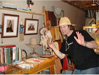 Color photograph of Gary waving from his studio