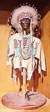 Mixed media sculpture of an Indian Chief in ceremonial dress