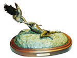 Bronze sculpture on wood base of an Indian catching an Eagle